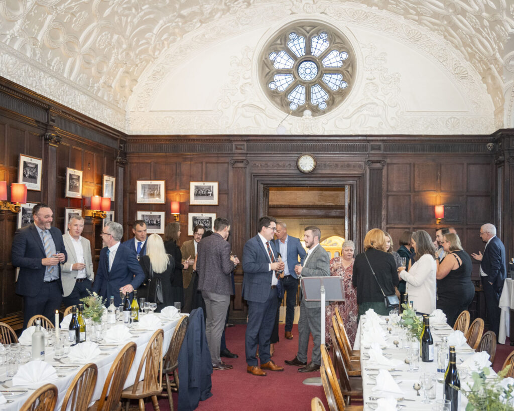 Fellows and guests engage in conversation at the Oxford Union.